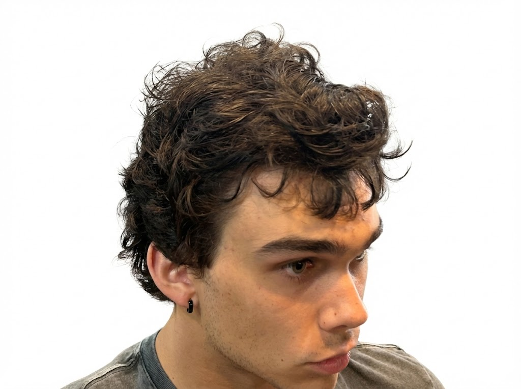 Young man with natural curly textured hairstyle